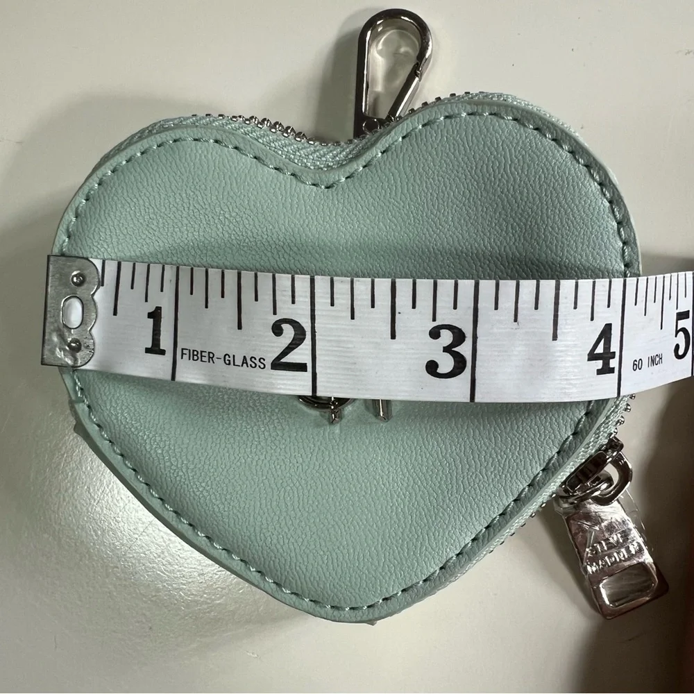 NWOT Steve Madden Frosty Green Coin Pouch. Plastic protector still on zipper tab